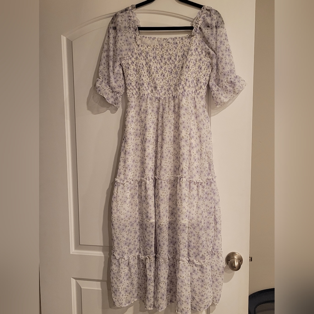 White dress with purple flowers.